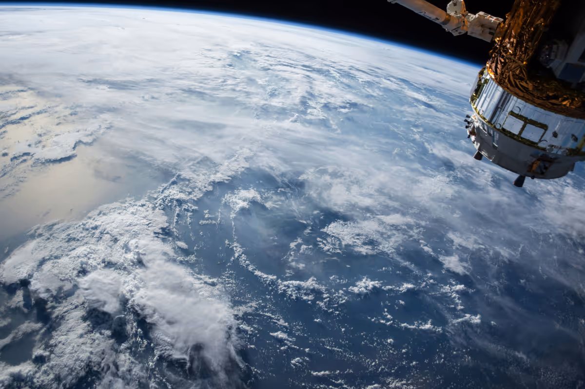 Upper atmosphere photo with satellite
