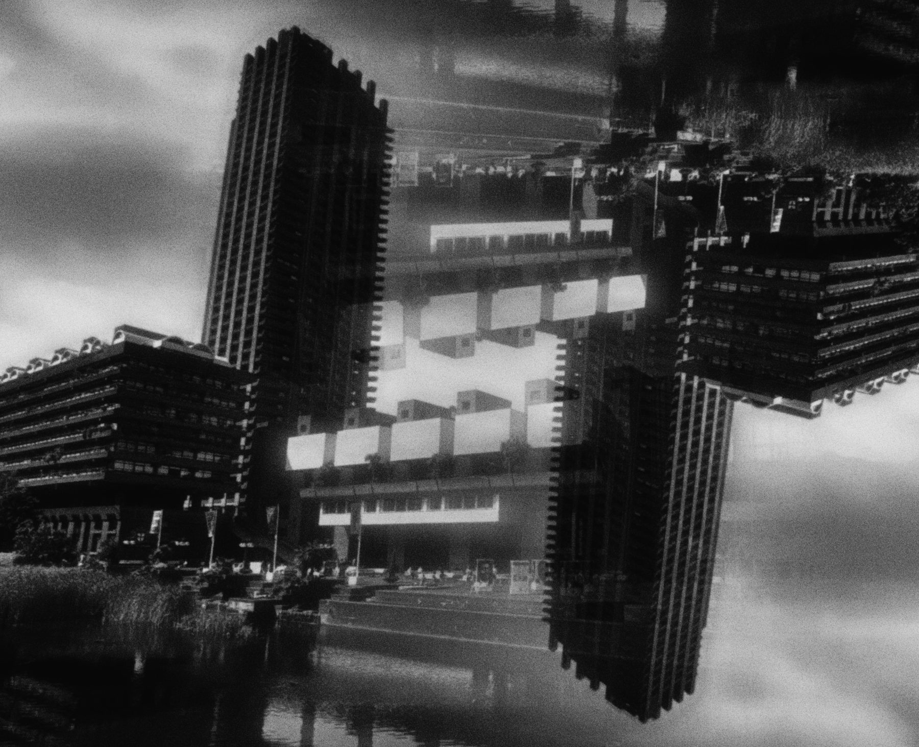 Black and white tower blocks mirrored into a symmetrical cluster of buildings