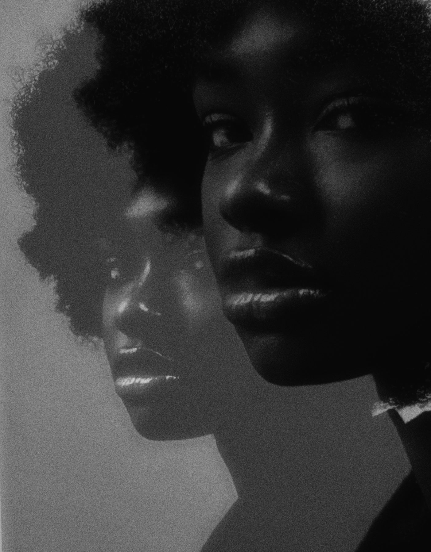 A black and white portrait with a second, softer copy of the face offset behind it
