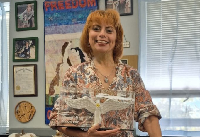 Christine Dorchak from GREY2K USA Worldwide holding a Limited Edition Saint Grey mini