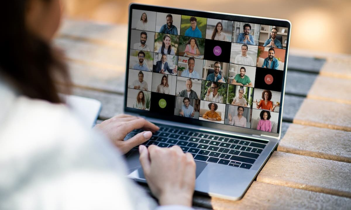 Laptop screen showing people on a video call