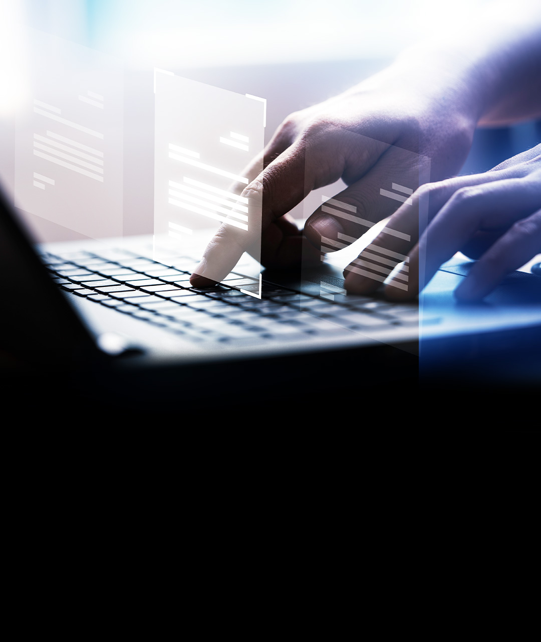 A close-up photo of someone typing on their laptop.