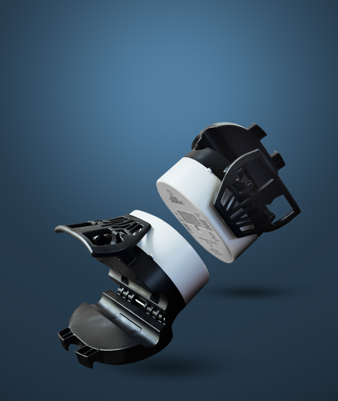 Two Umeter Clamps facing opposite ways, in their opened position, on a clean blue background.