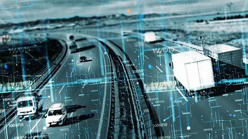 Vehicles on the highway with digital overlay highlighting ai echnology