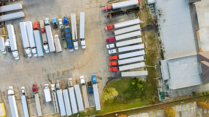 Flatbed, reefer, and tanker trucks lined up representing different trucking niches.