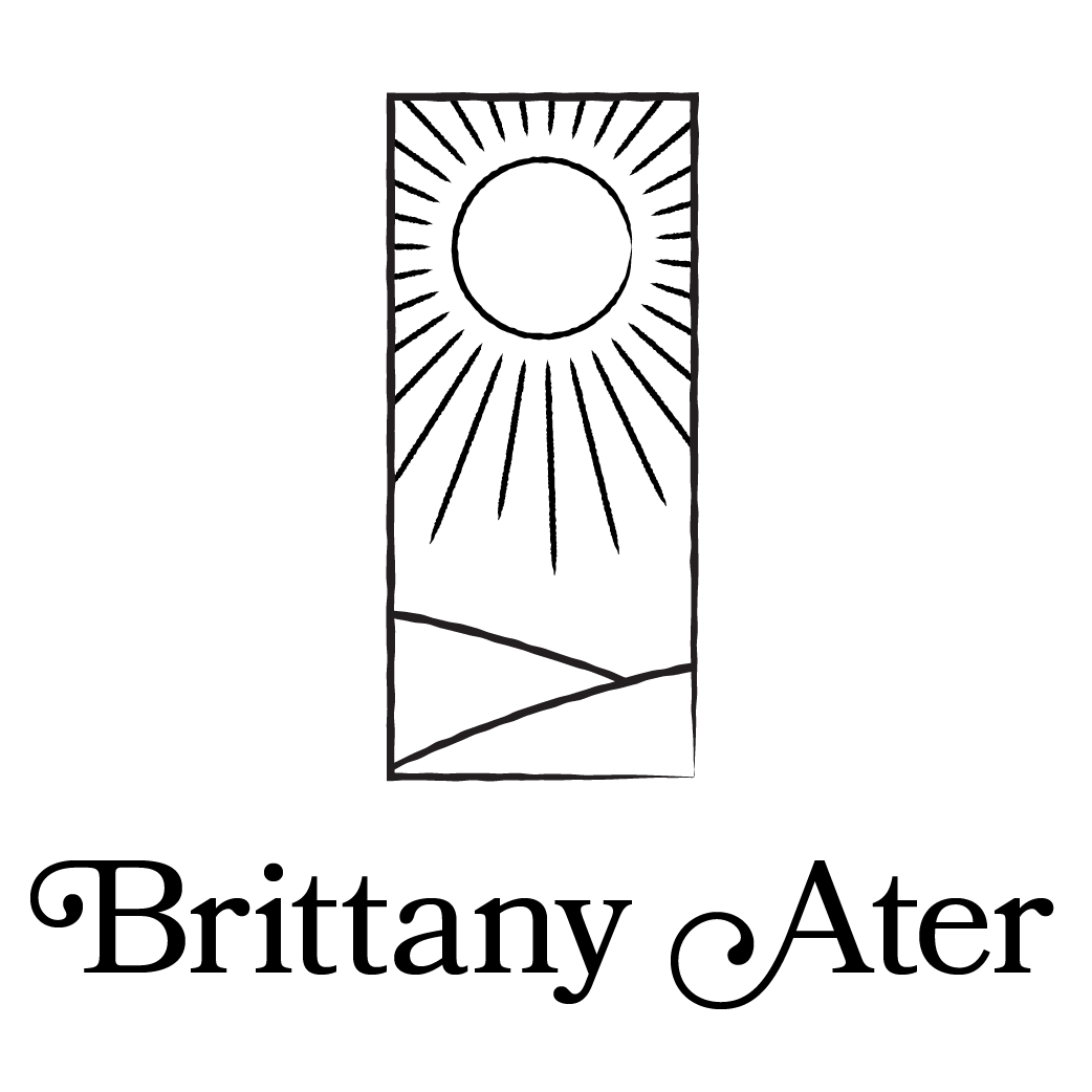 Black and white logo with a sun above rolling hills in a rectangular frame, with the name Brittany Ater below in decorative font.