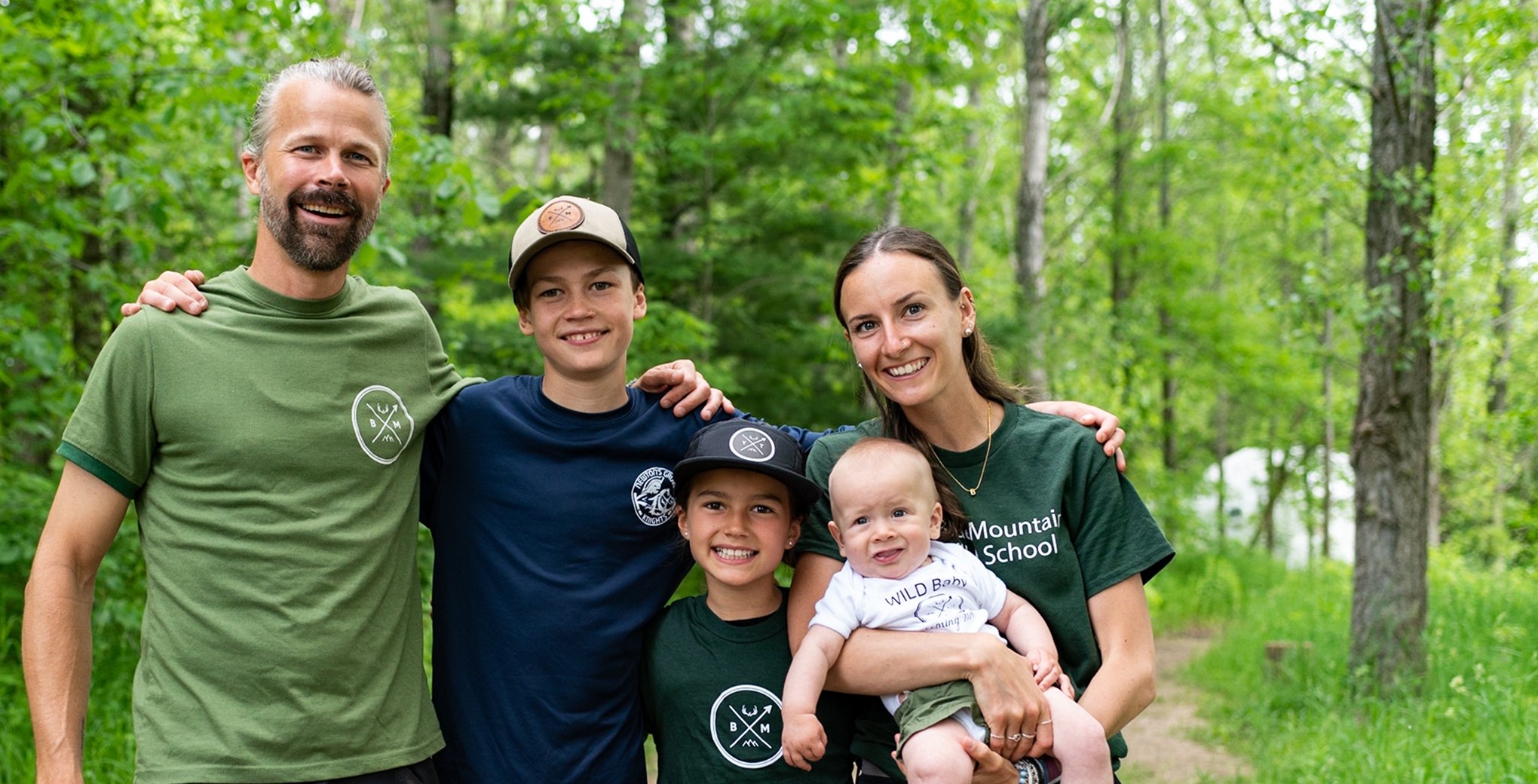 Ali with her family of five on a forest path