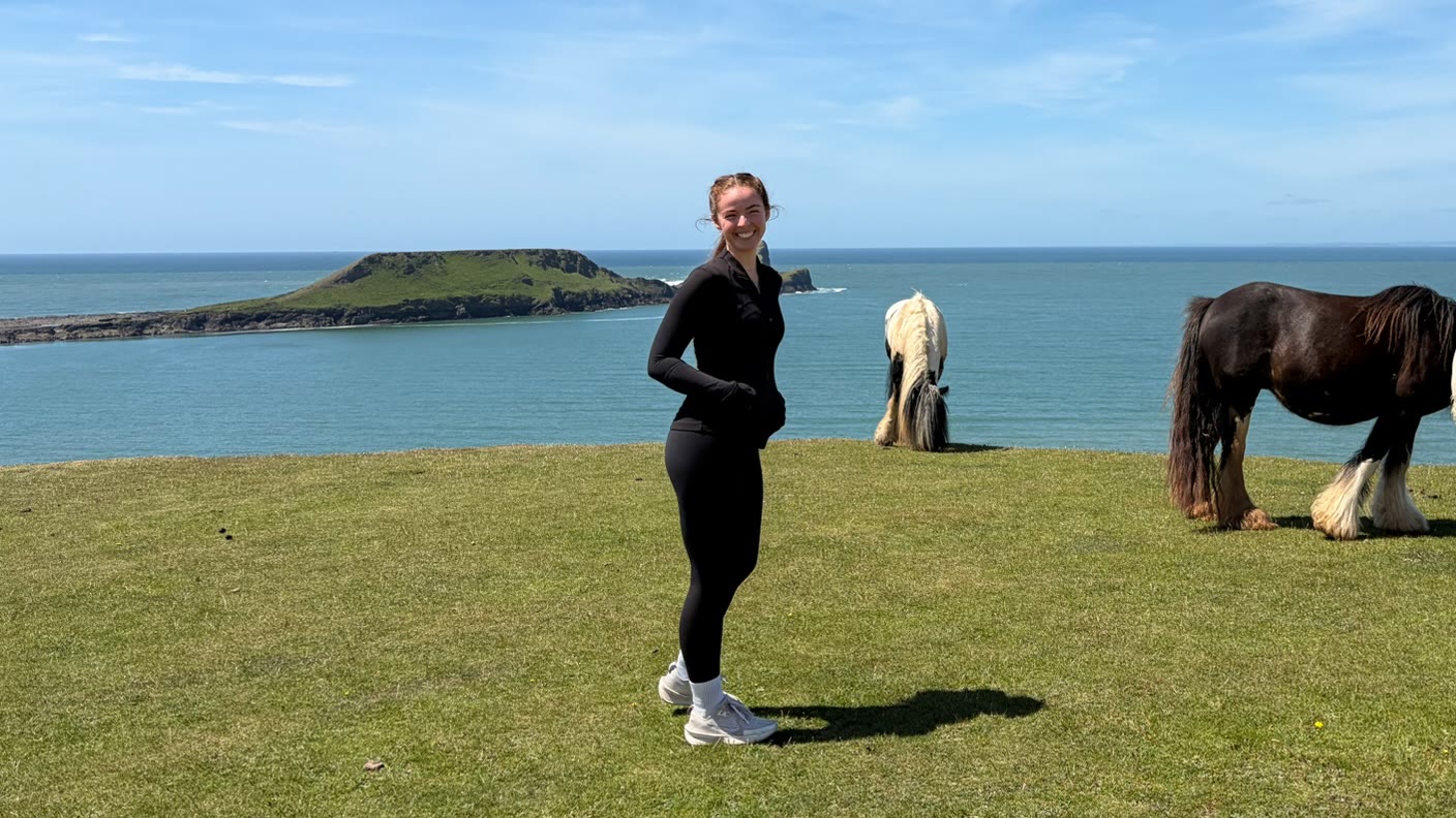 Grace on a clifftop with horses