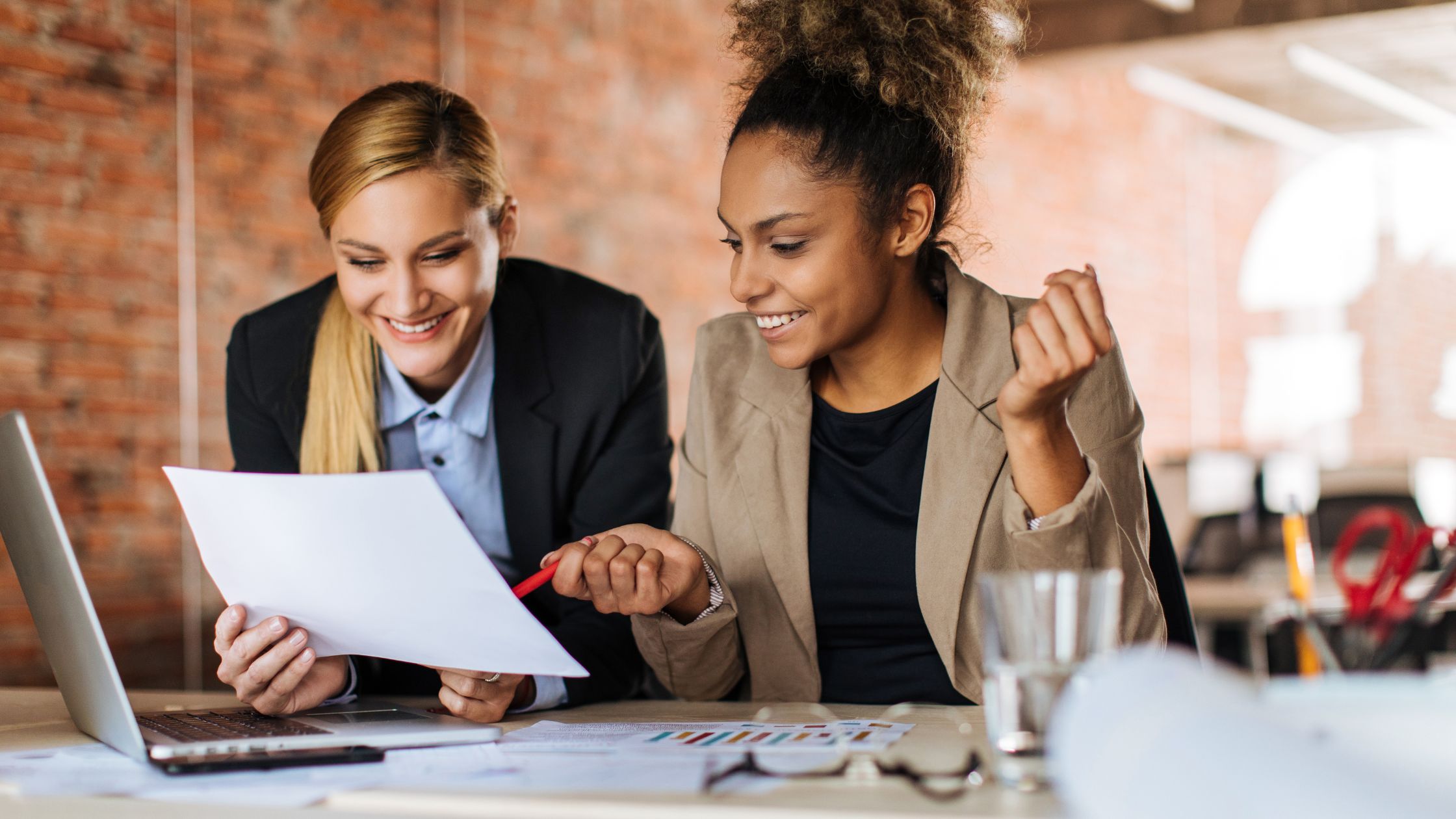 two HR professionals solving problems together
