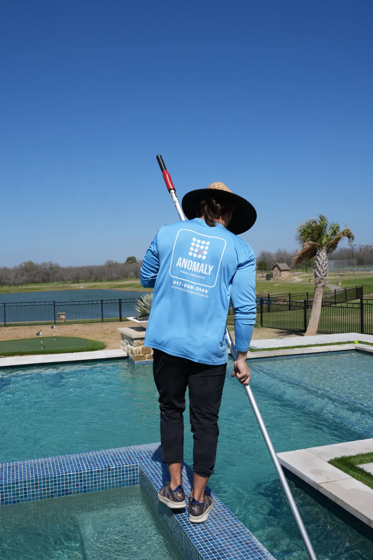 Our team servicing a weekly pool cleaning client in Southlake TX