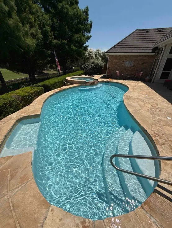 Our team servicing a weekly pool cleaning client in Southlake TX
