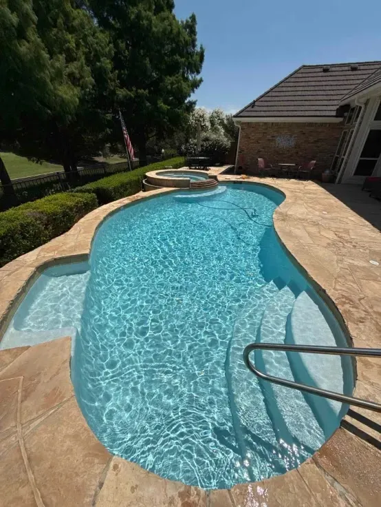 Our team servicing a weekly pool cleaning client in Southlake TX