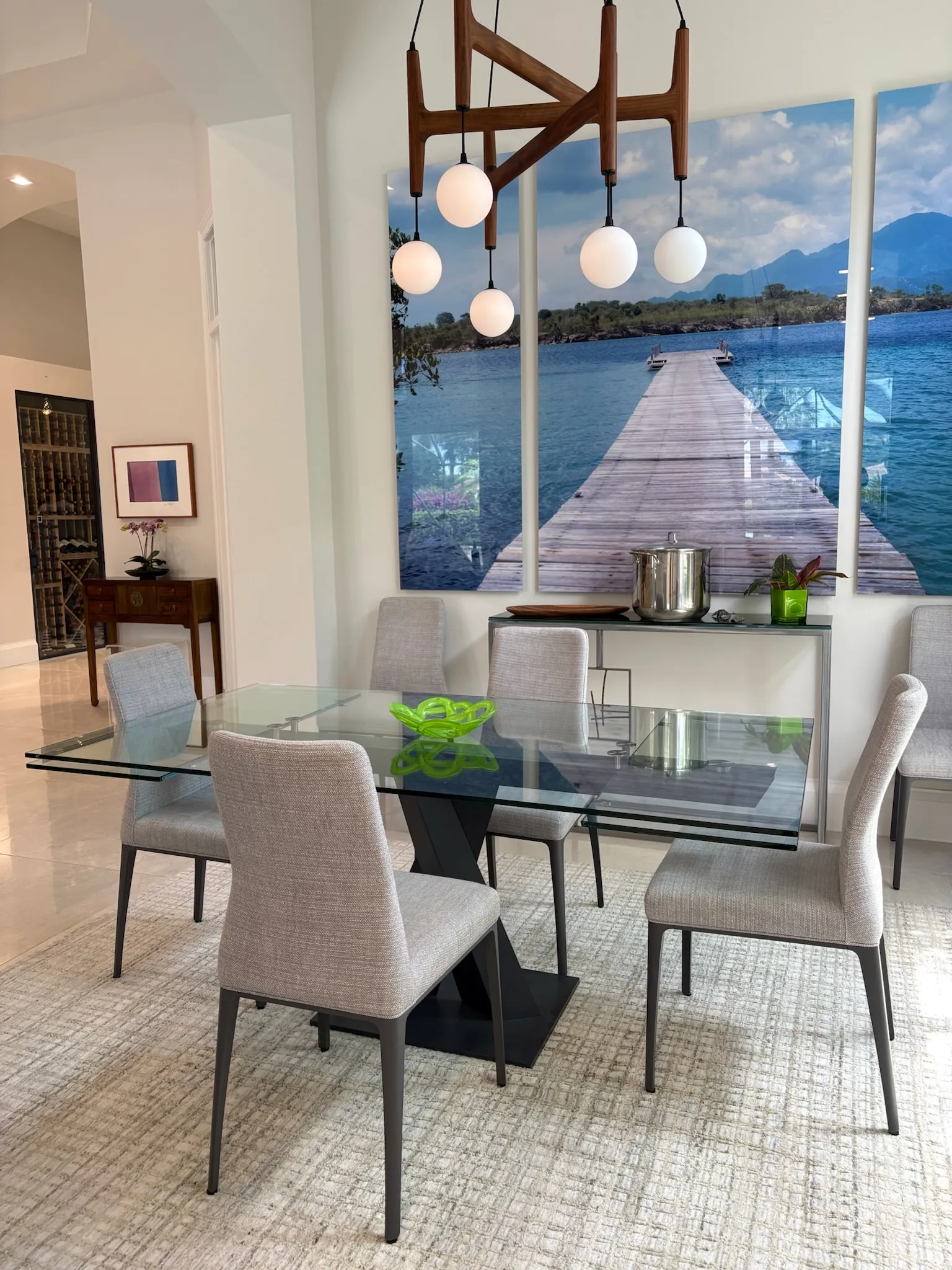 Shiny glass dining table with aesthetic décor