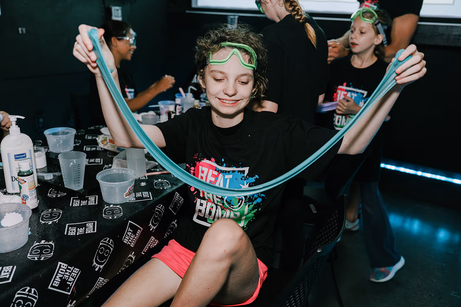 Ka-Boom camper playing with a slime stretch