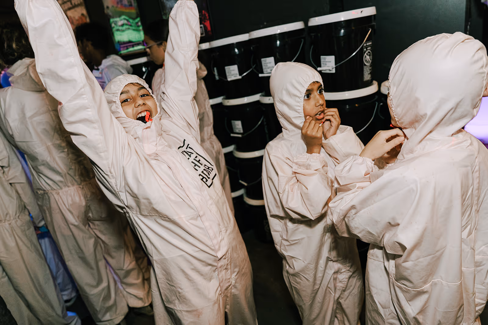 Ka-Boom campers cheering wearing their hazmat suits