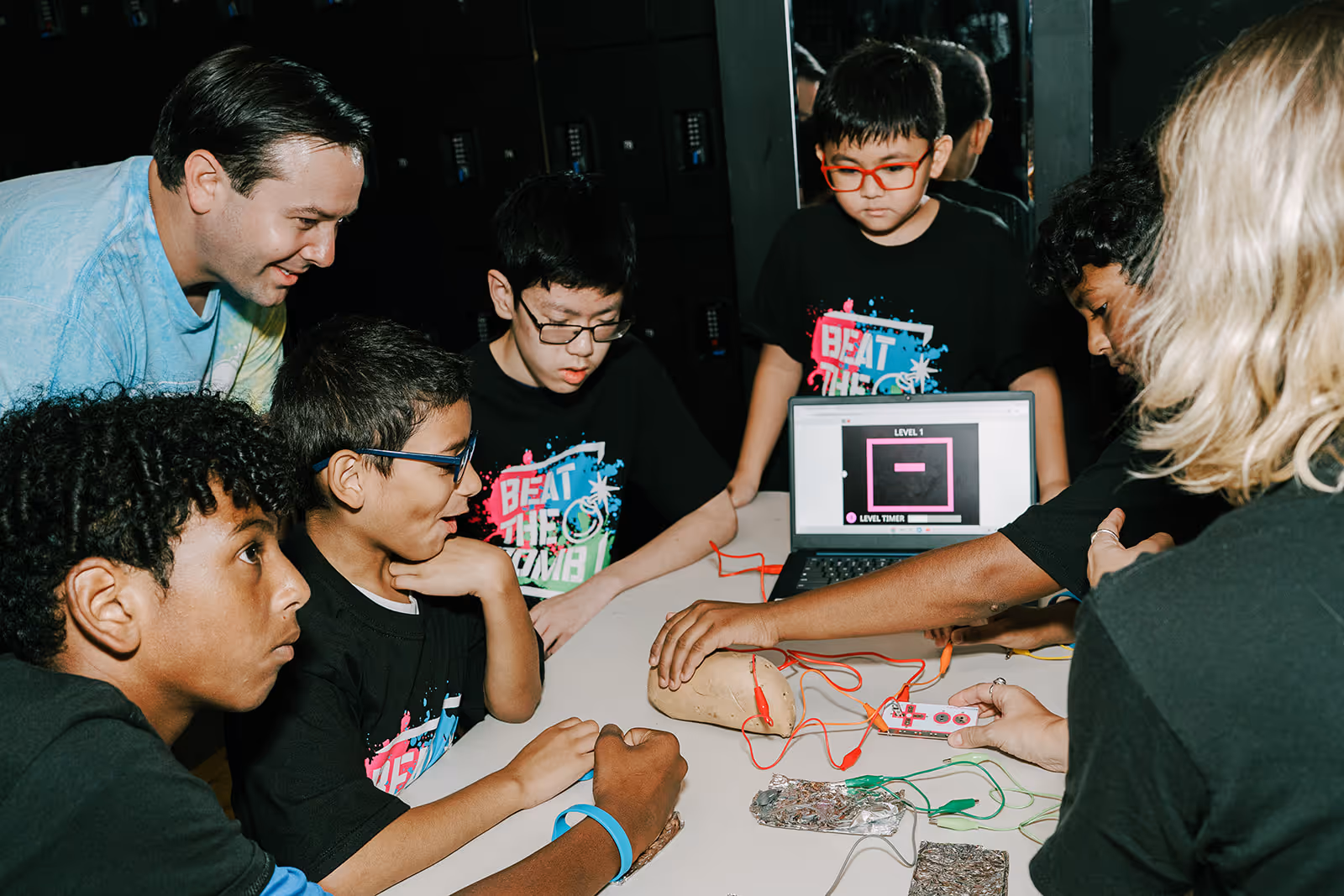 Ka-Boom campers using a potato to control a Scratch video game