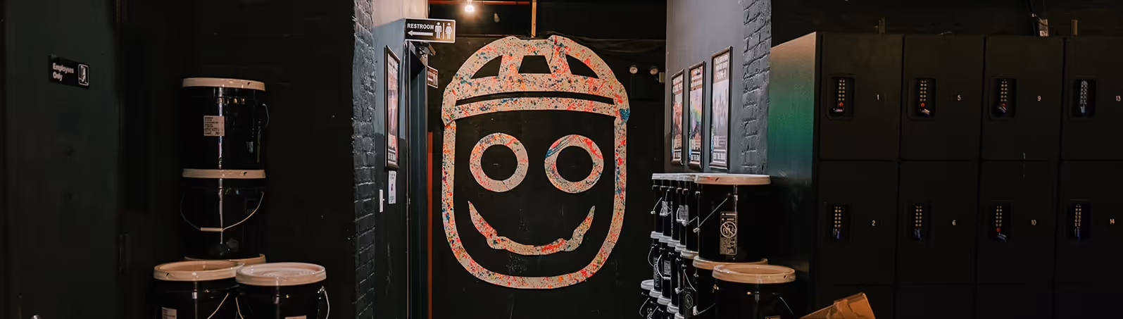 Hallway shot of the Brooklyn space with the Bombie logo spraypainted on the wall