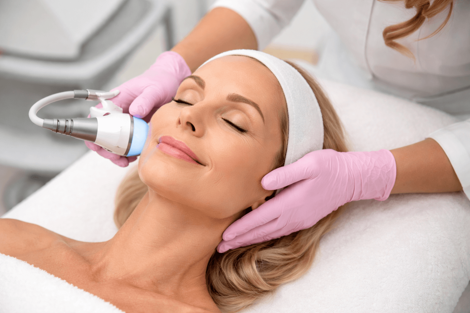 Patient receiving non-invasive skin tightening treatment in Hingham Massachusetts for firmer, smoother skin