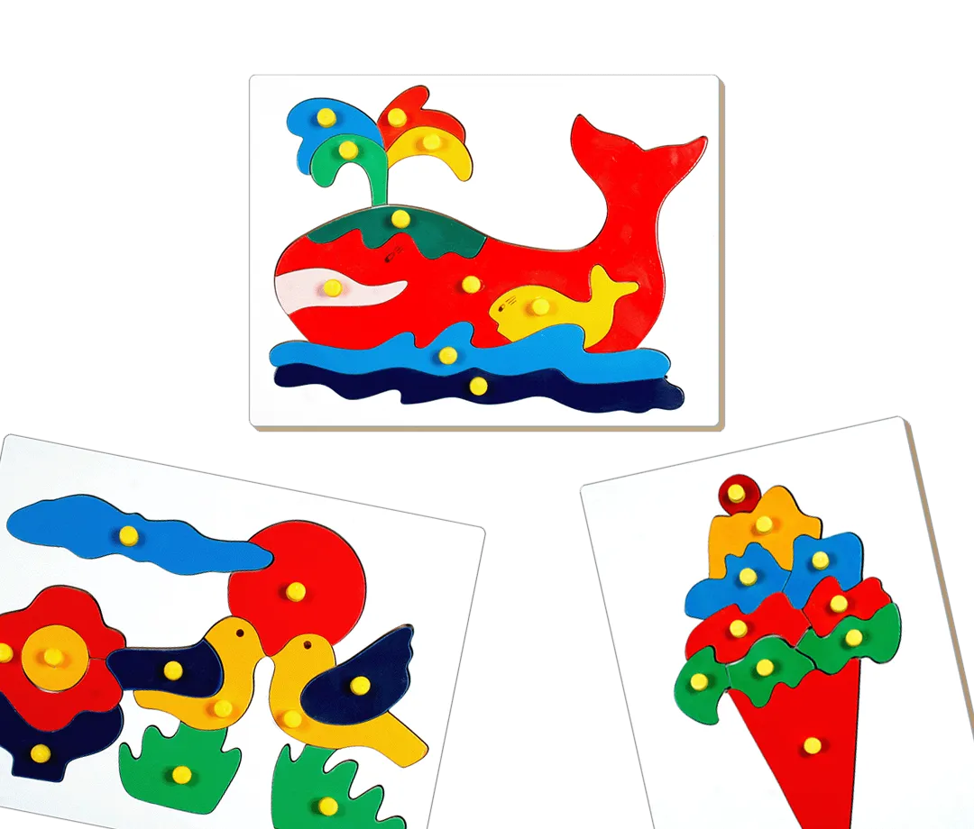 Three colorful wooden puzzles featuring a red whale with a yellow fish and water spray, two yellow and black birds with a red sun and flower, and a bouquet of red, blue, and orange flowers with green leaves.
