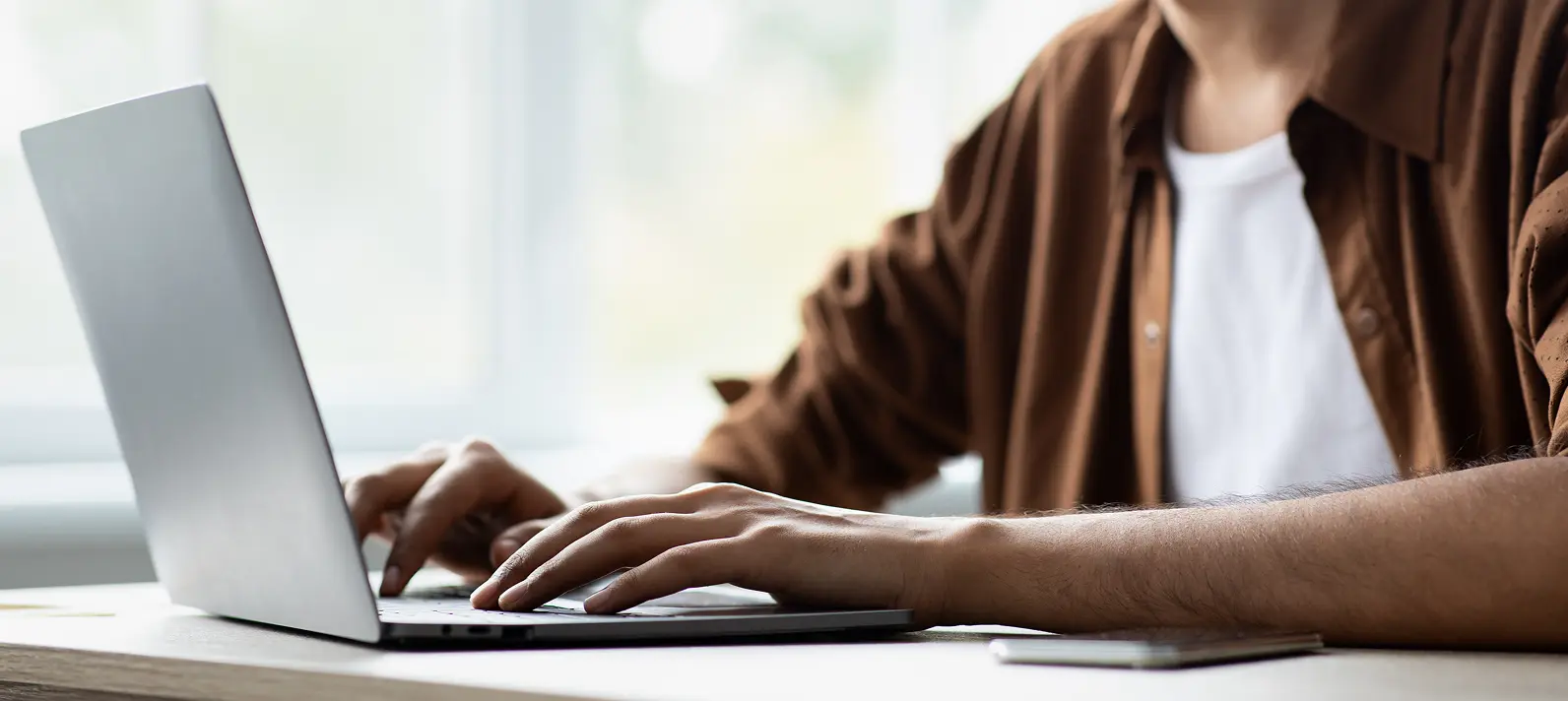 Man typing on laptop