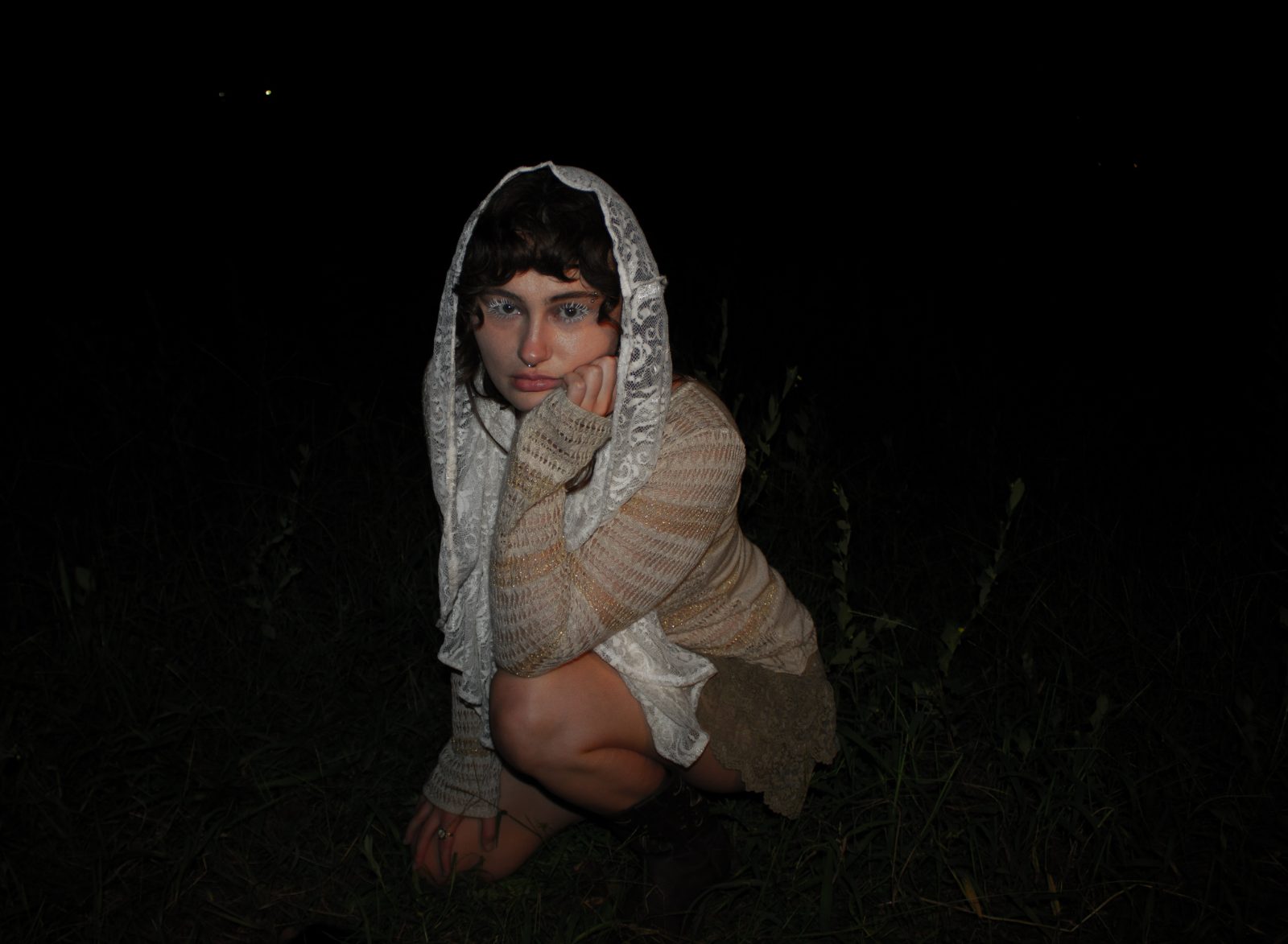 Night editorial in a lace veil, lit by a single lantern