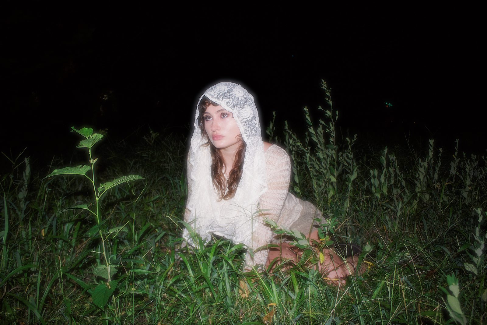 Night editorial in a lace veil, lit by a single lantern