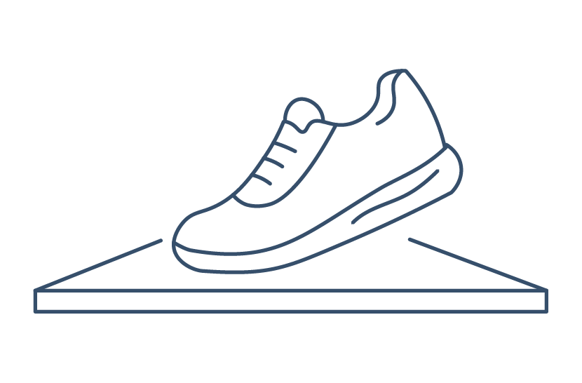 Outline of a sneaker on a triangular surface representing slip resistance.