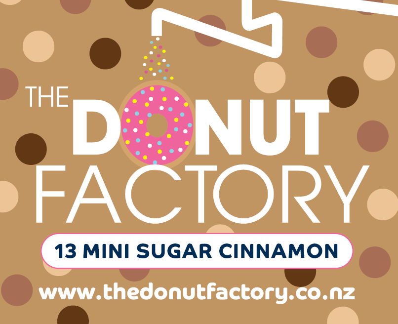 A crop of The Donut Factory label for their sugar cinnamon donuts. A dark blue background, with coloured dots with the logo featuring in the middle