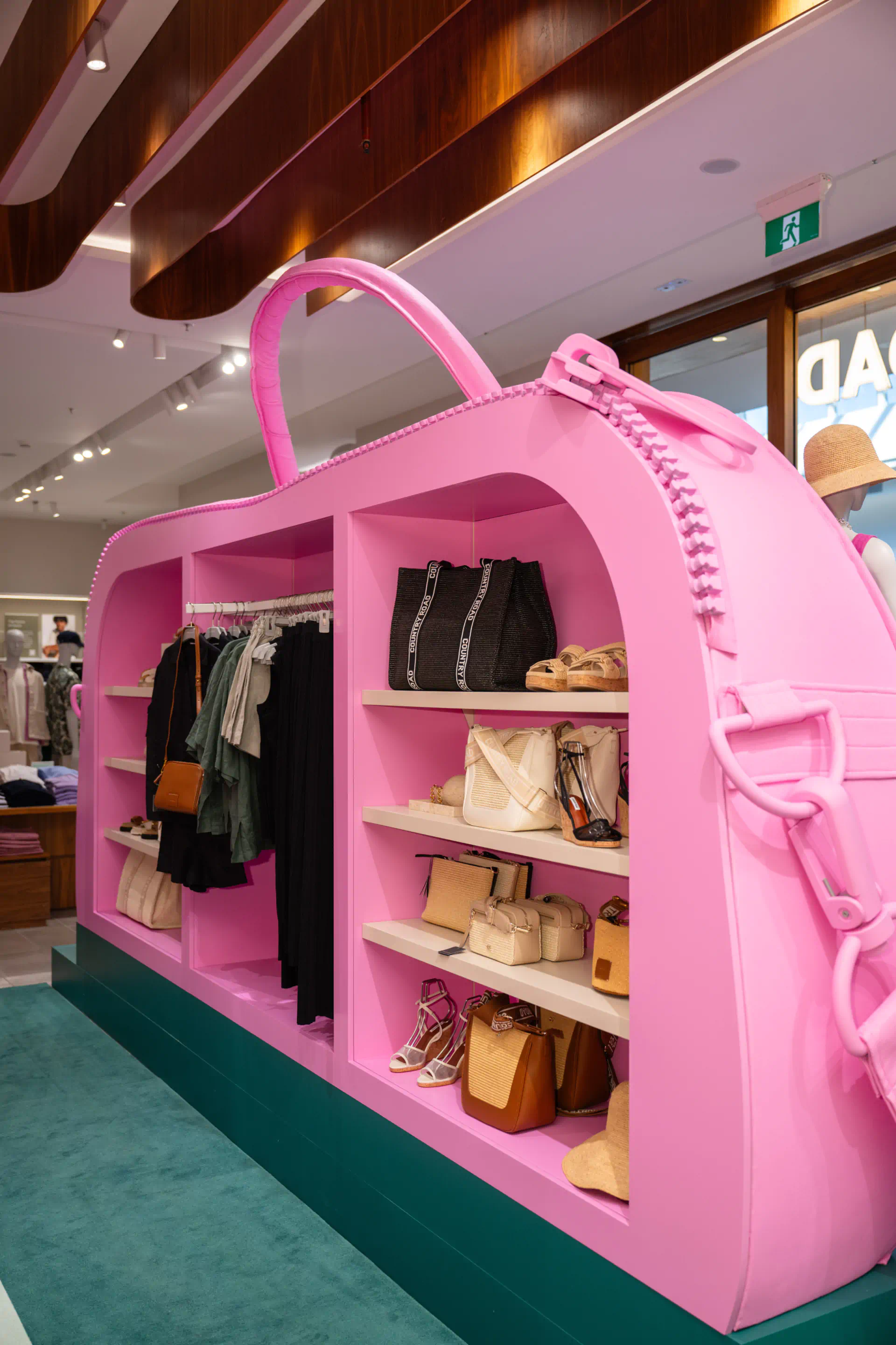 a pink purse display in a store
