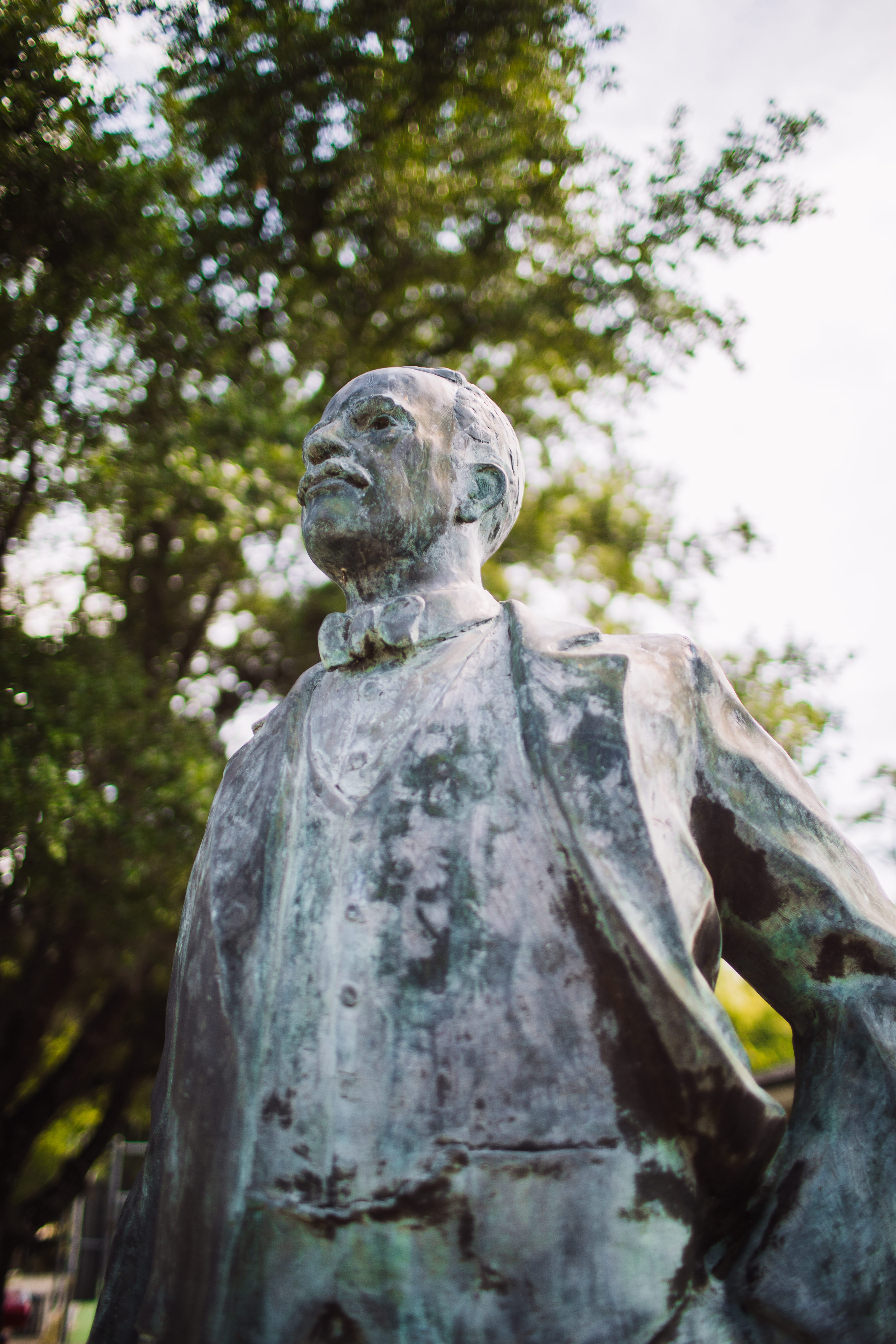 A statue of a man with a coat on