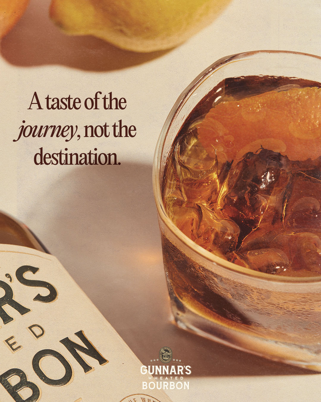 A bottle of rum and a glass of rum on a table