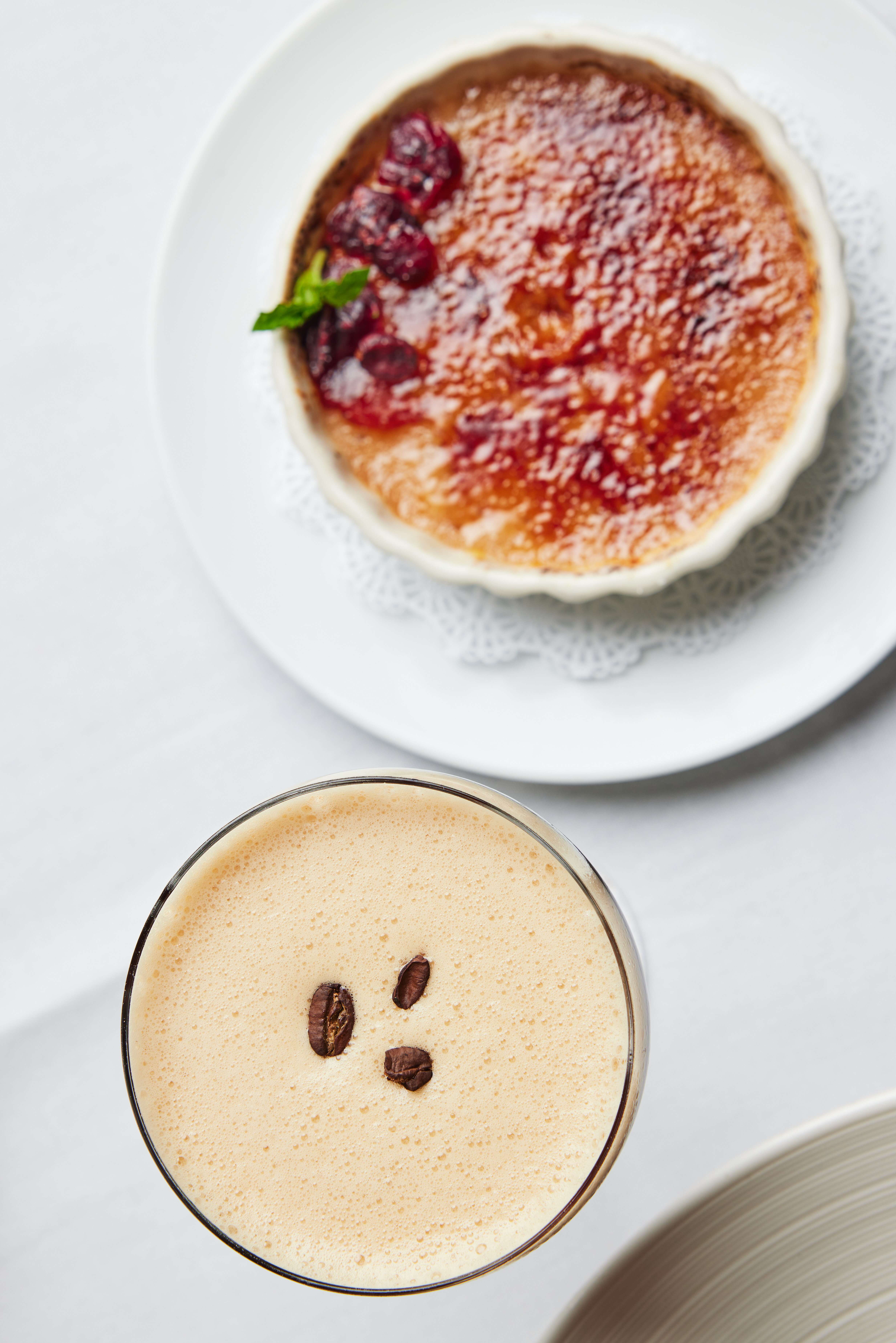 A cup of coffee with a smiley face drawn on it