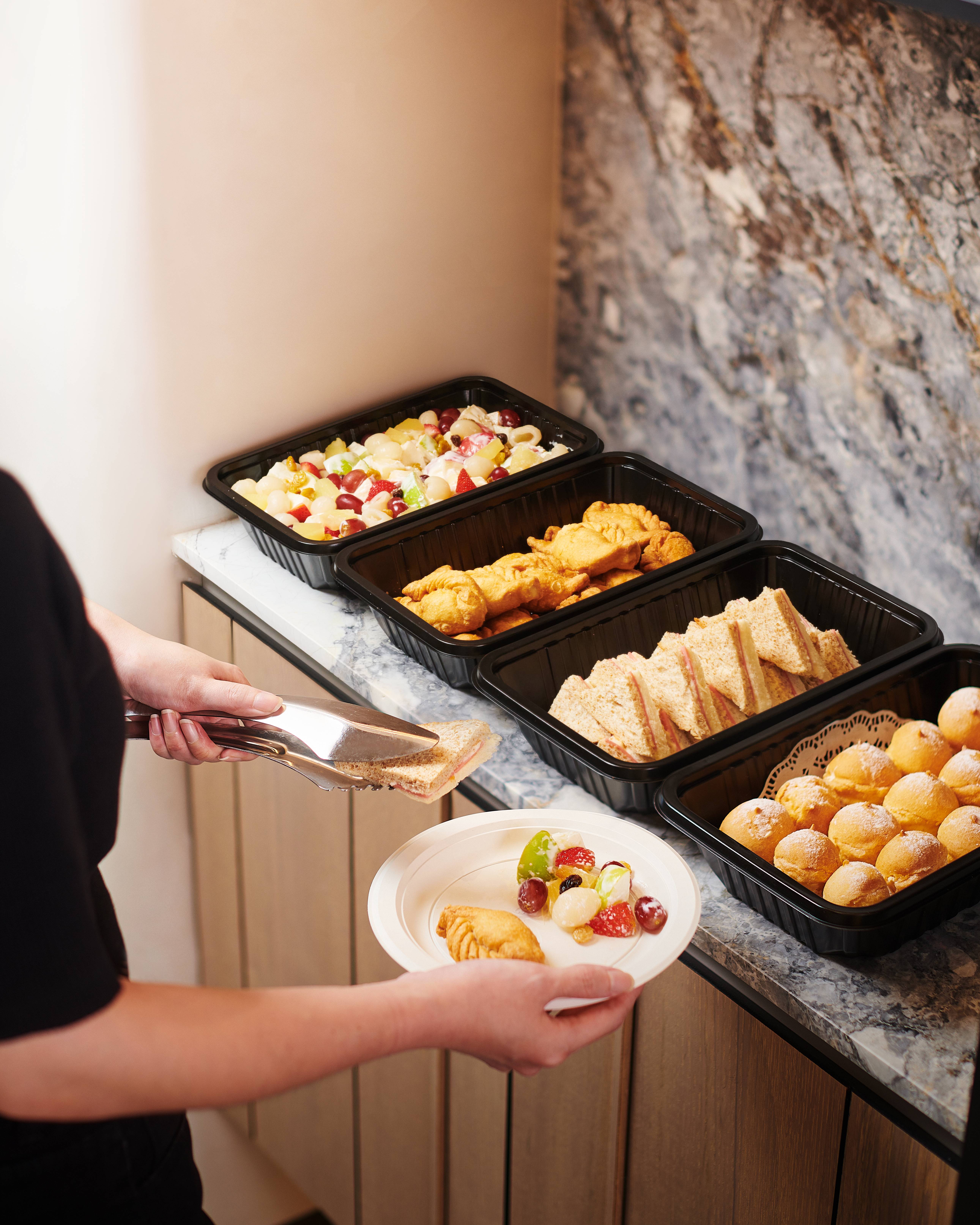 Guests sampling CaterCo’s assortment of premium teas and bite-sized sweets
