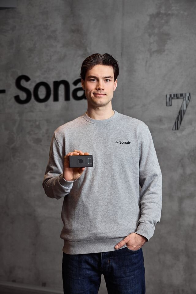 A man at Sonair testing the sensor on a robot.