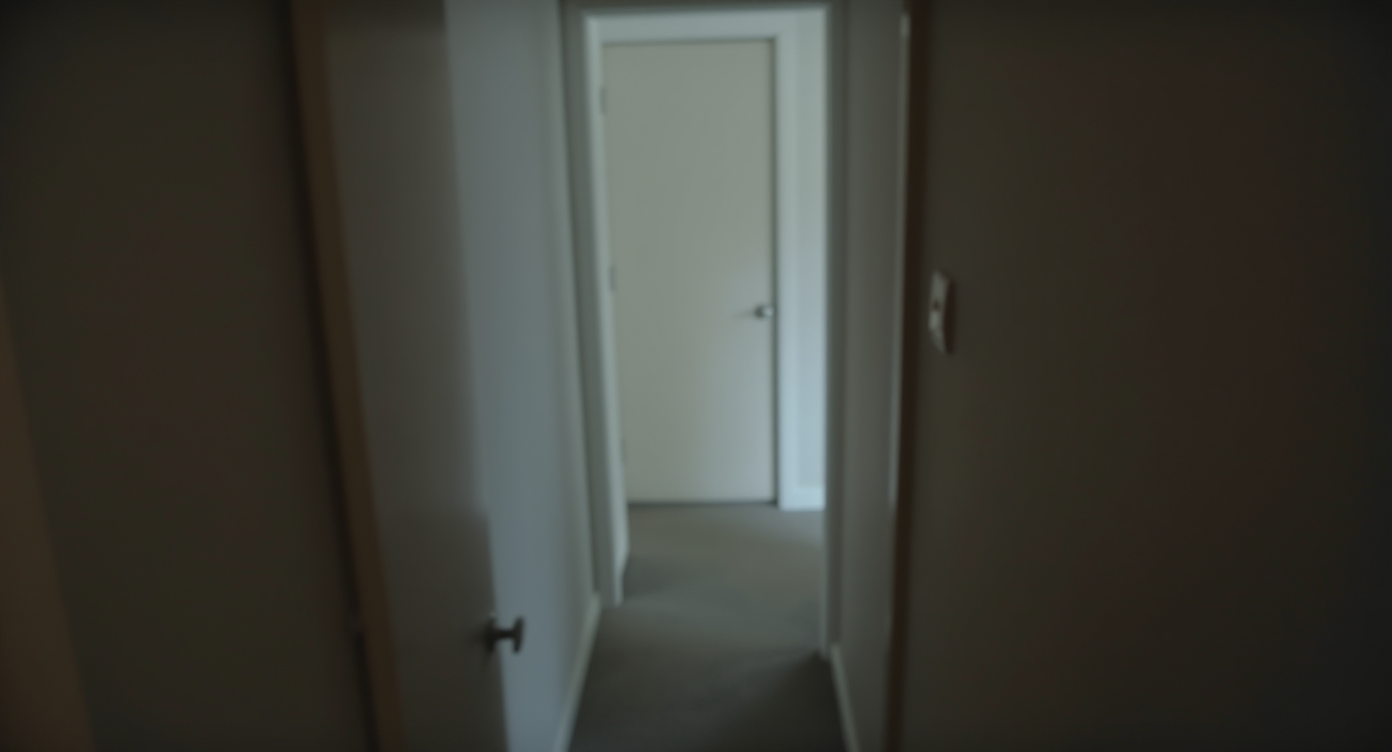 Tilted hallway photo with leaning walls that make the space appear narrow and distorted.