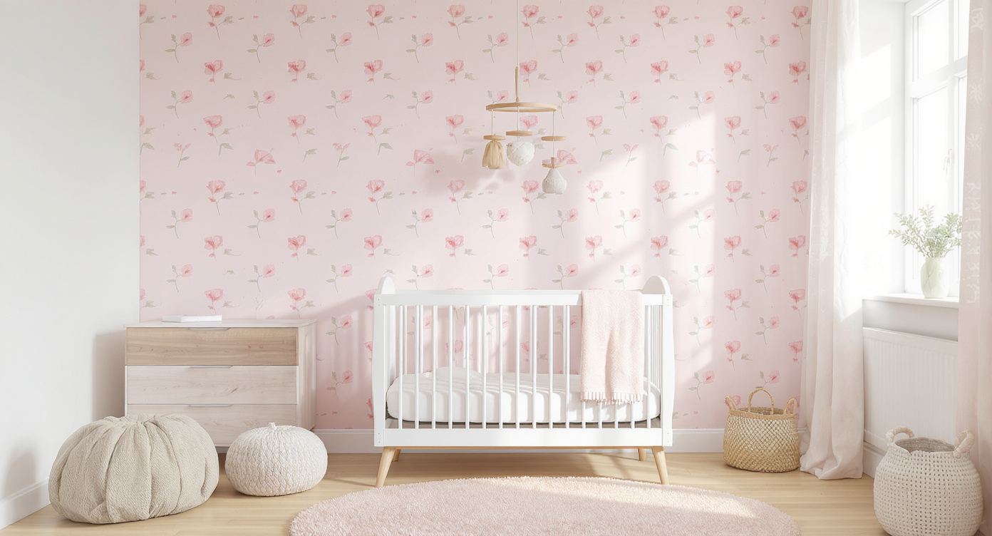 Serene nursery with dainty floral wallpaper on one wall, a white crib, wooden dresser, and blush rug, highlighted by natural light.