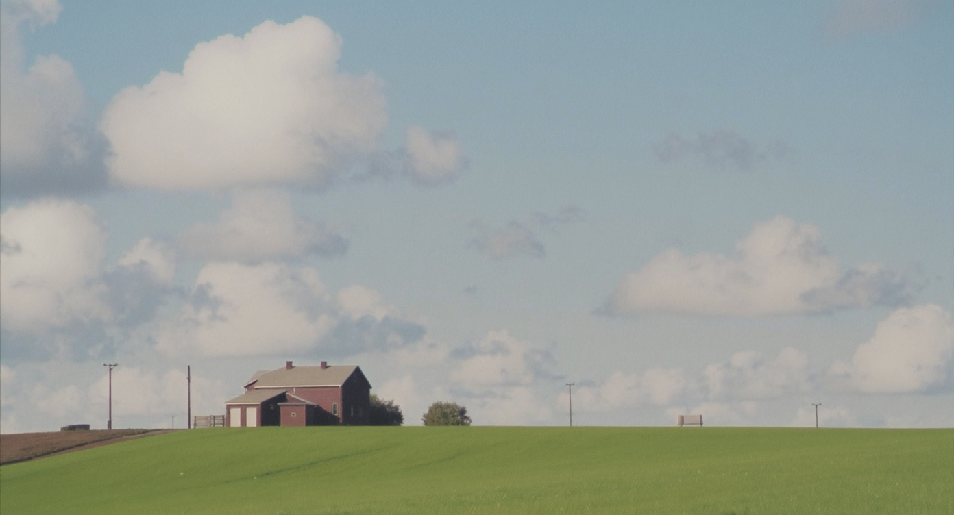 Modern dining area in an open-plan home, with a wooden table, four upholstered chairs, tasteful lighting, artwork, and clean, inviting design.