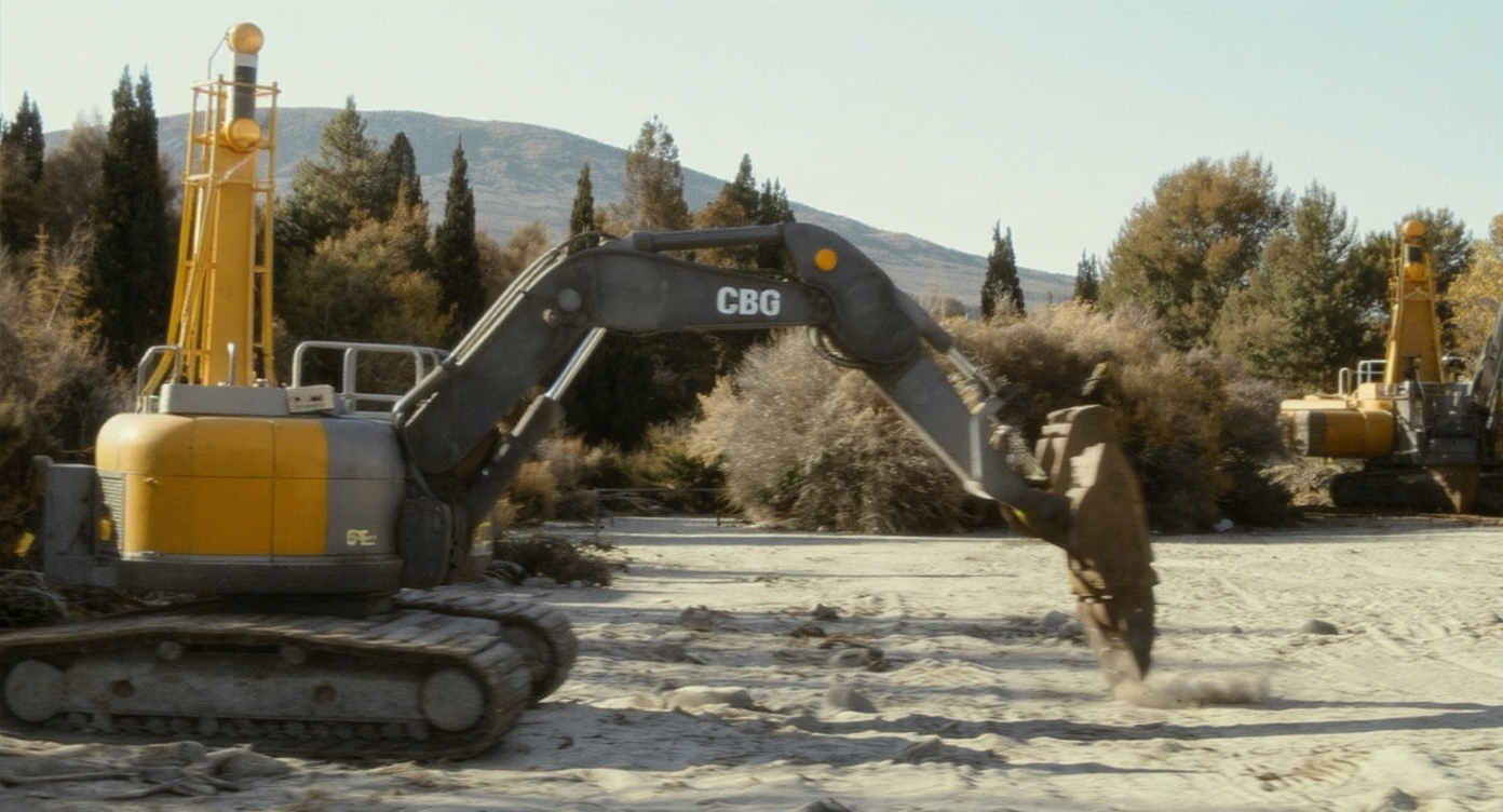 Spacious luxury bathroom featuring a freestanding stone tub, living plant wall, large windows with lush greenery view, and natural wood accents.