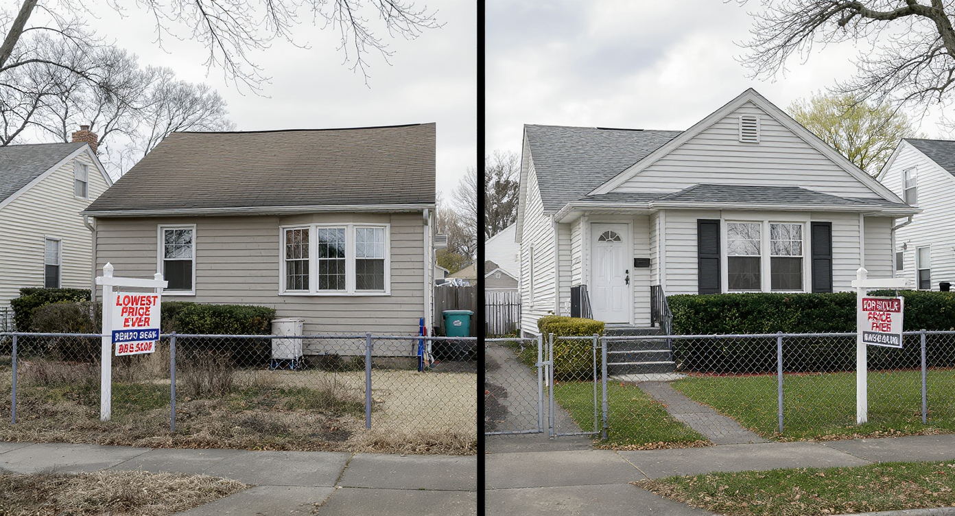 Two almost identical suburban starter homes side by side, one older with a much lower price sign, one updated with a much higher price sign, clear daylight.