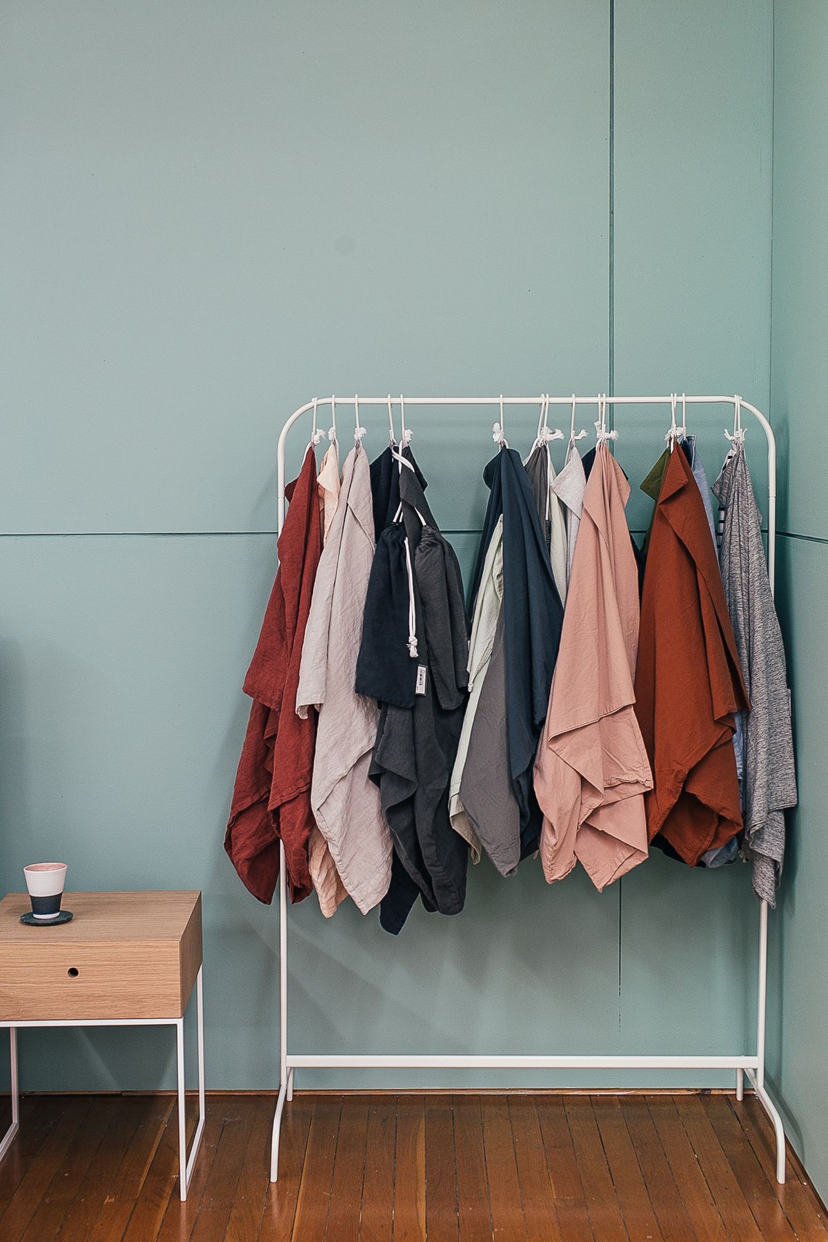 Curated apparel on a rack in a fashion boutique