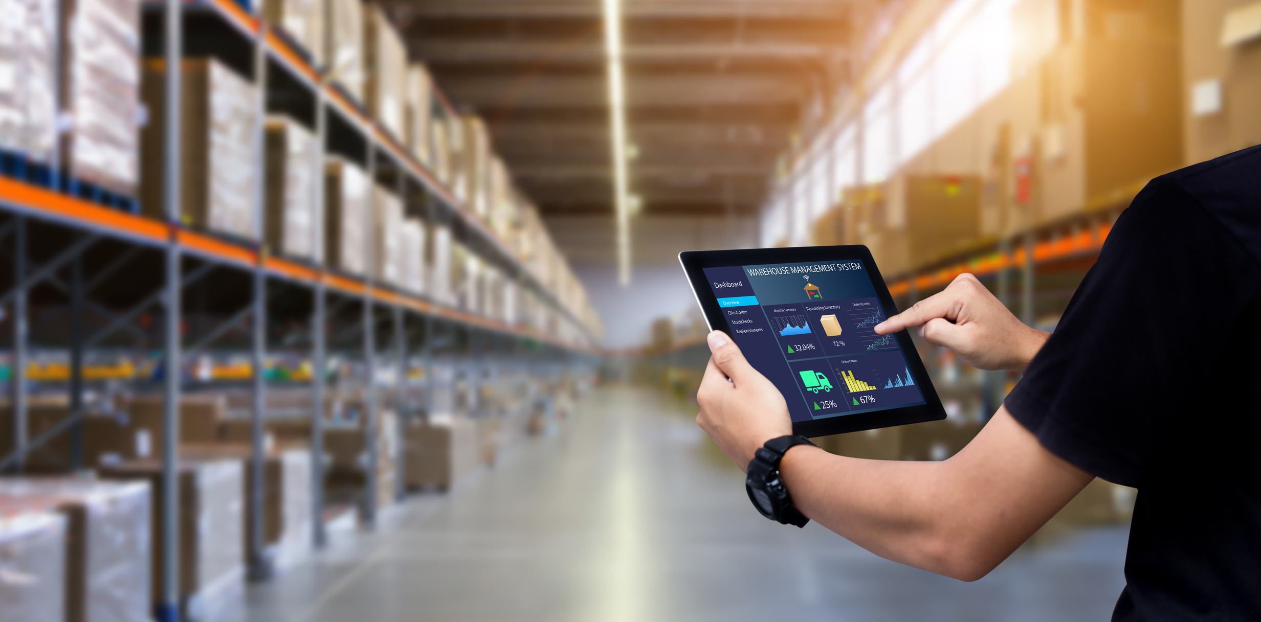 warehouse operative using a Optima's warehouse management tool via a tablet