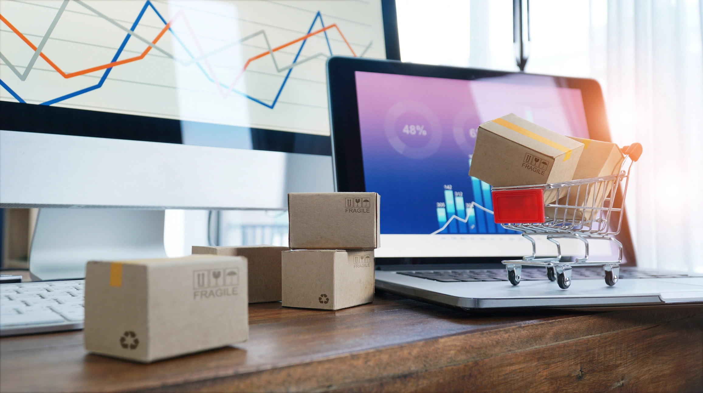 laptop showing customer orders and dynamic warehouse solutions software on the