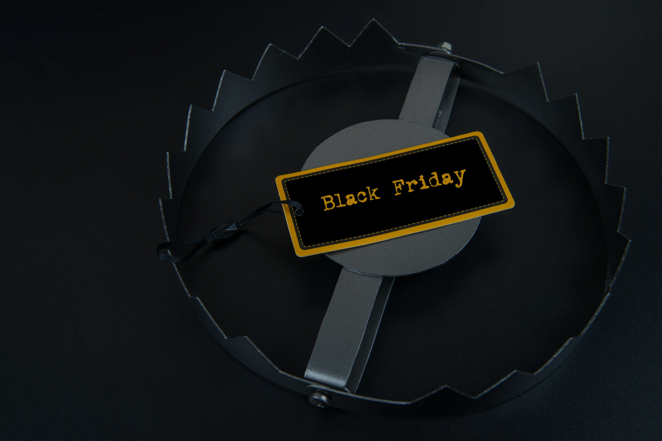 Black Friday shopping tag placed within a animal trap