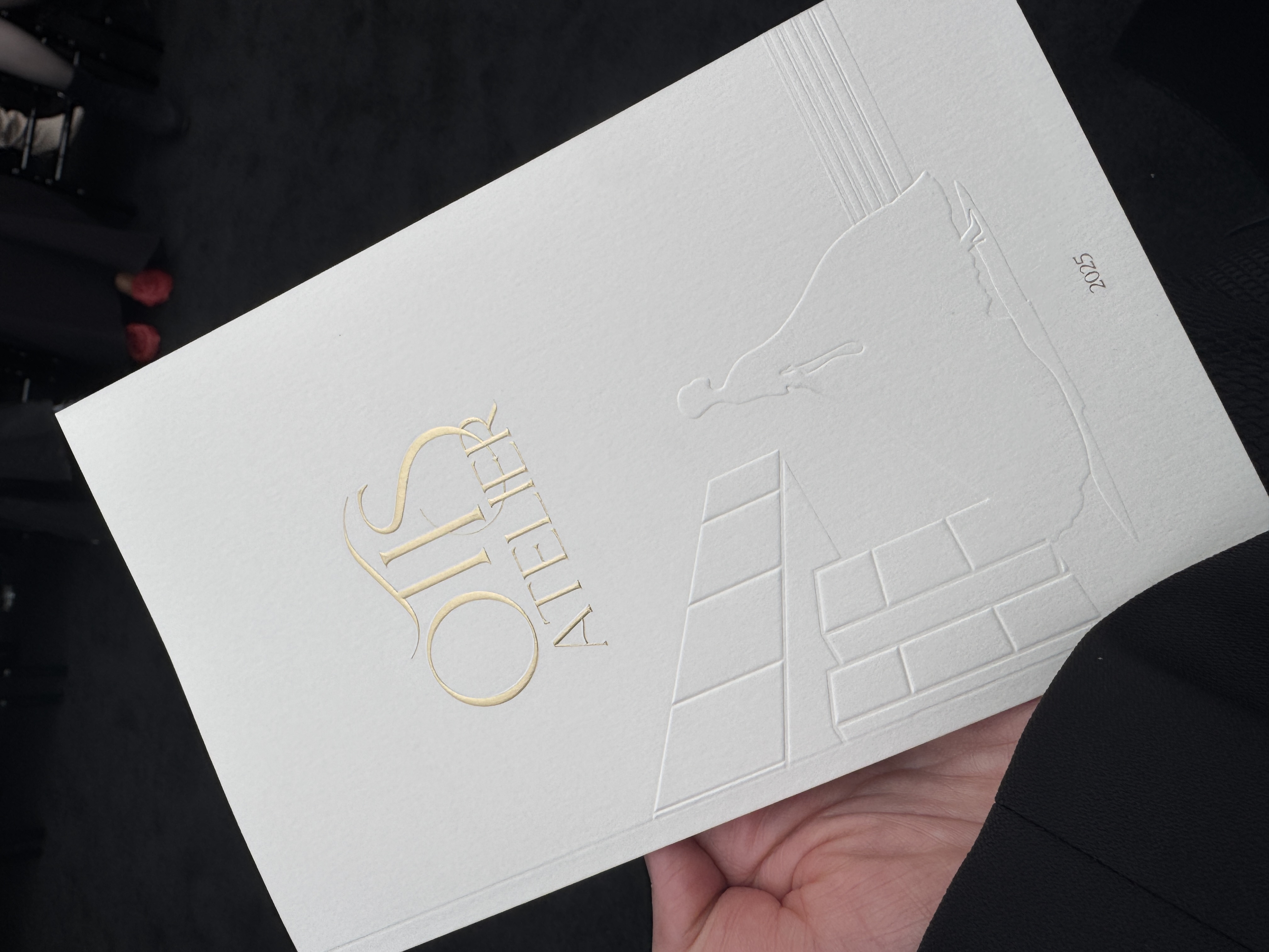 Custom debossed invitation designed by DTE studio for Otis Atelier Fashion Show