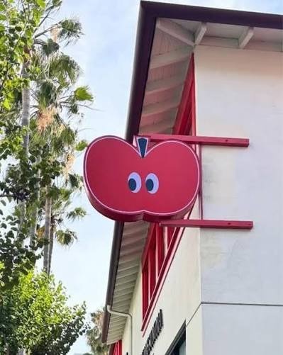 CIDER apple-shaped exterior sign at its Los Angeles store