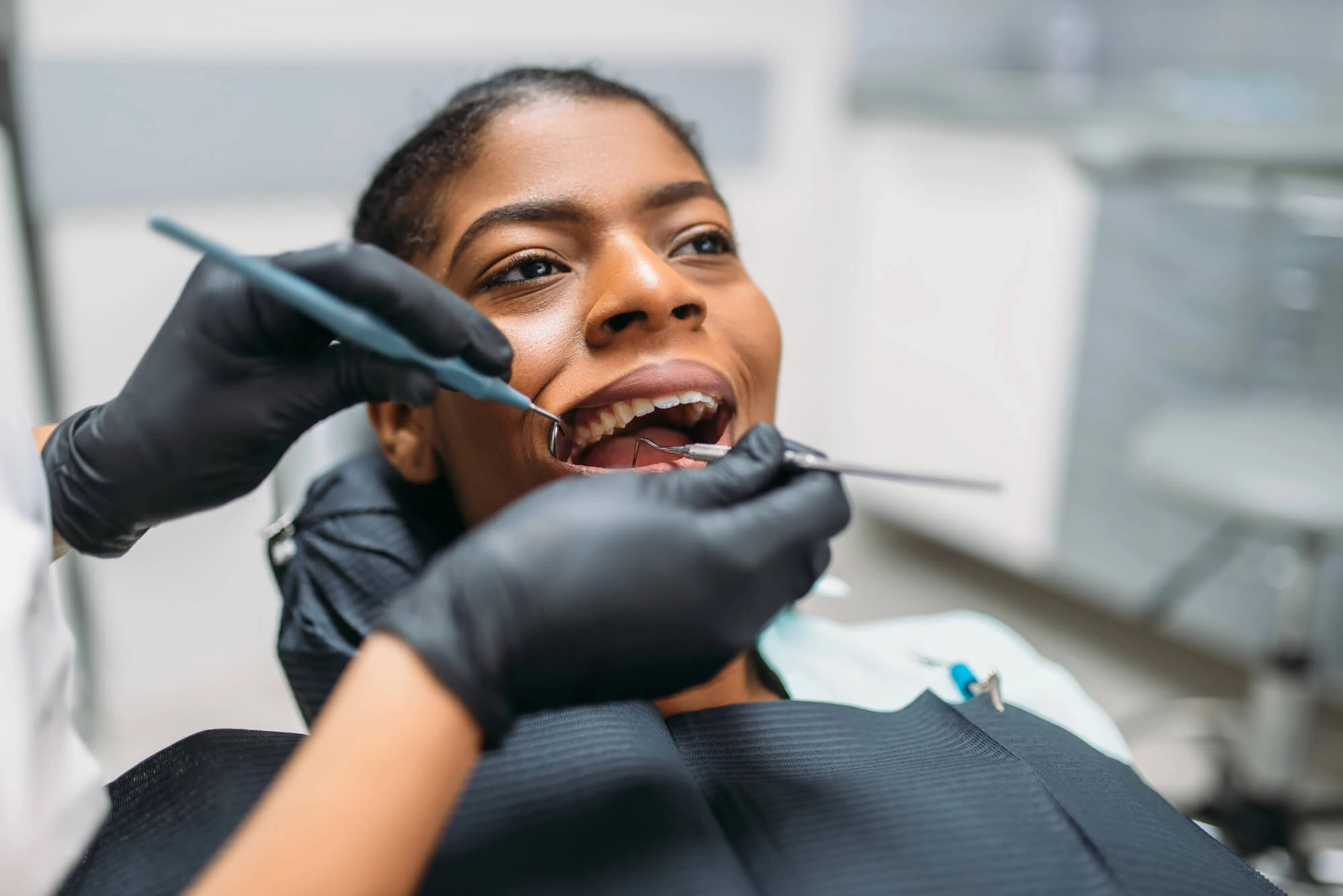 Patient receiving a dental cleaning from a dentist in Georgetown, KY