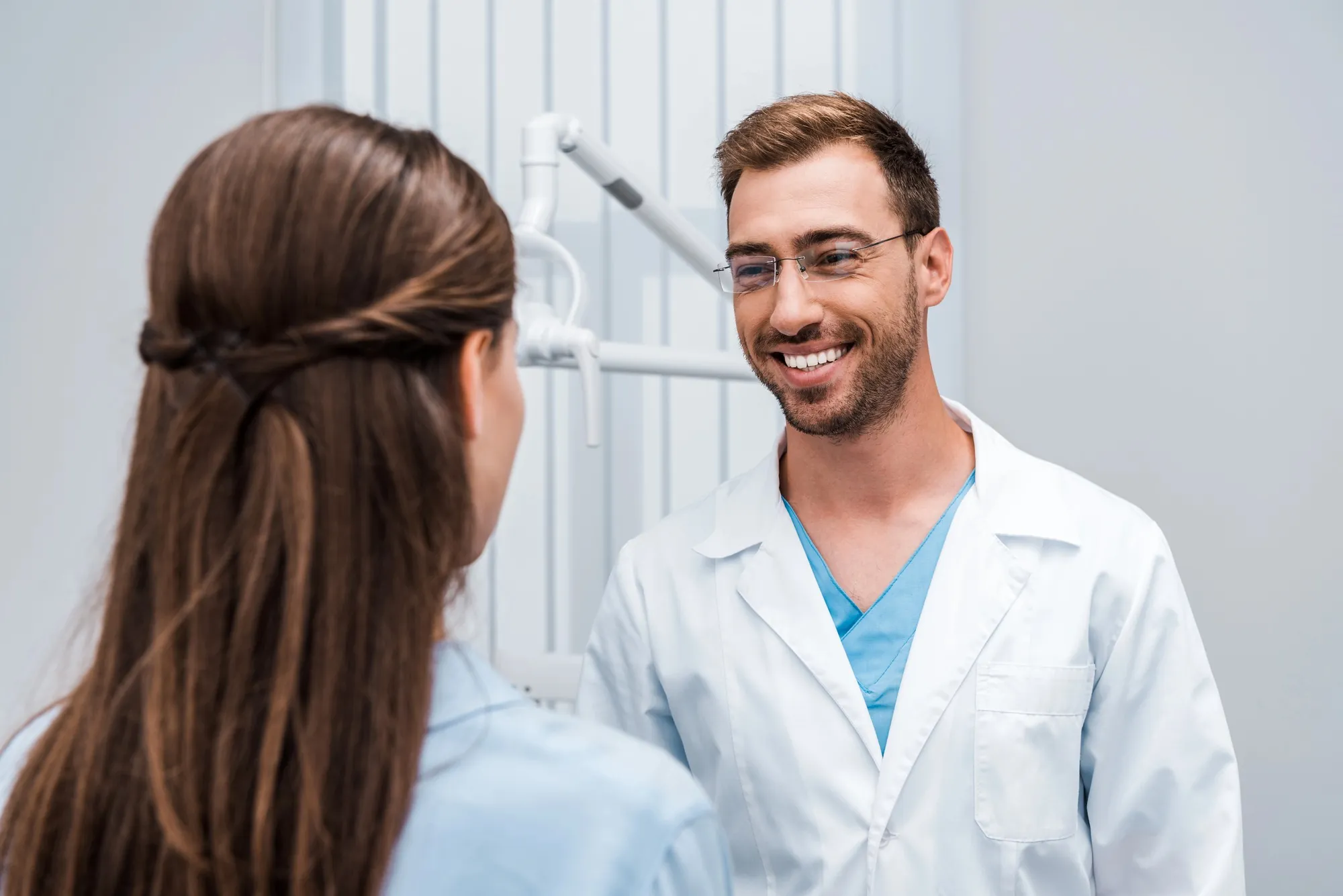 Friendly dentist at one of the Georgetown KY dental offices discussing treatment options with a patient