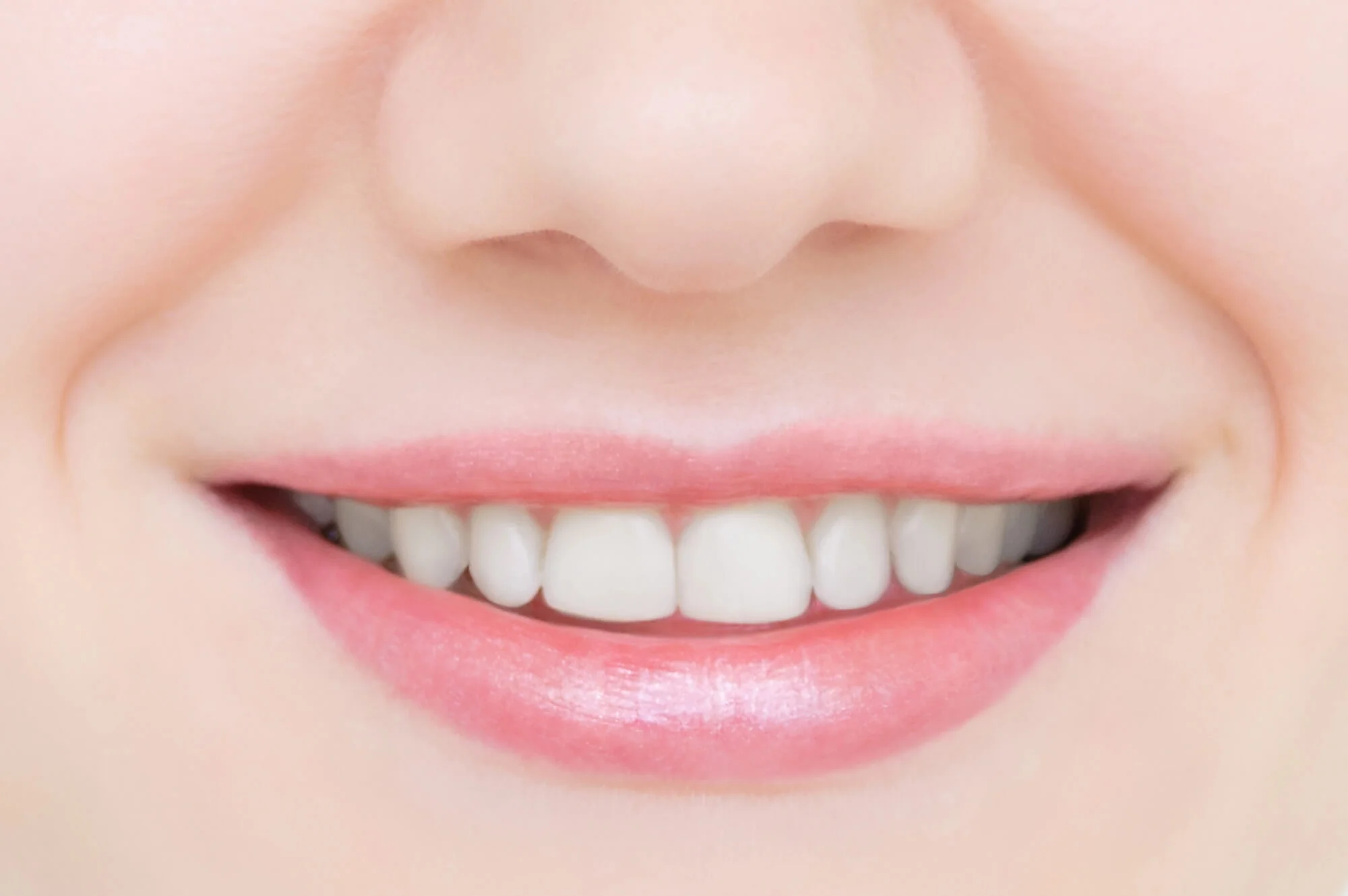 showing off her Same Day Dental Crowns