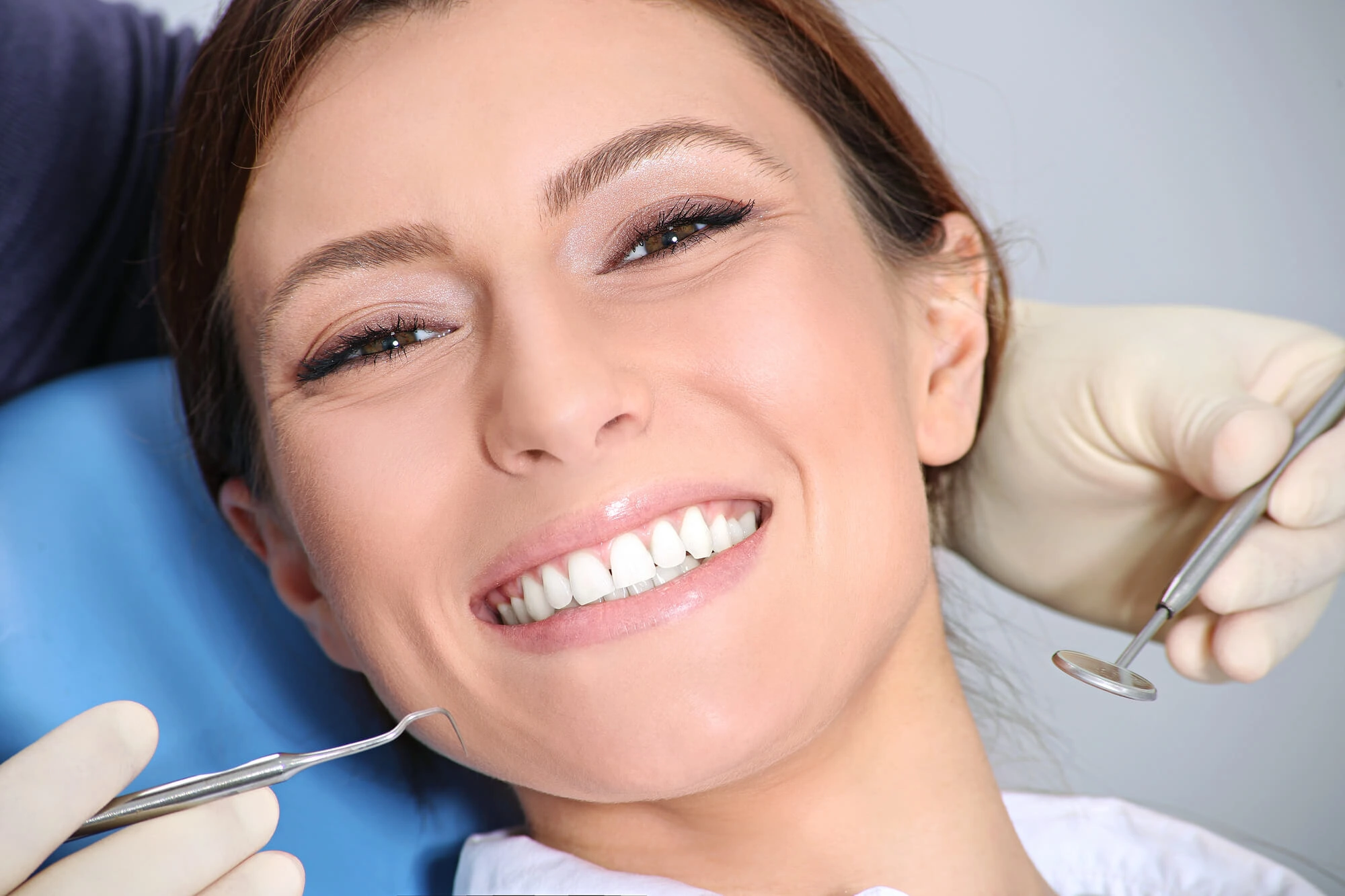 Girl happy after getting All on X Dental Implants 