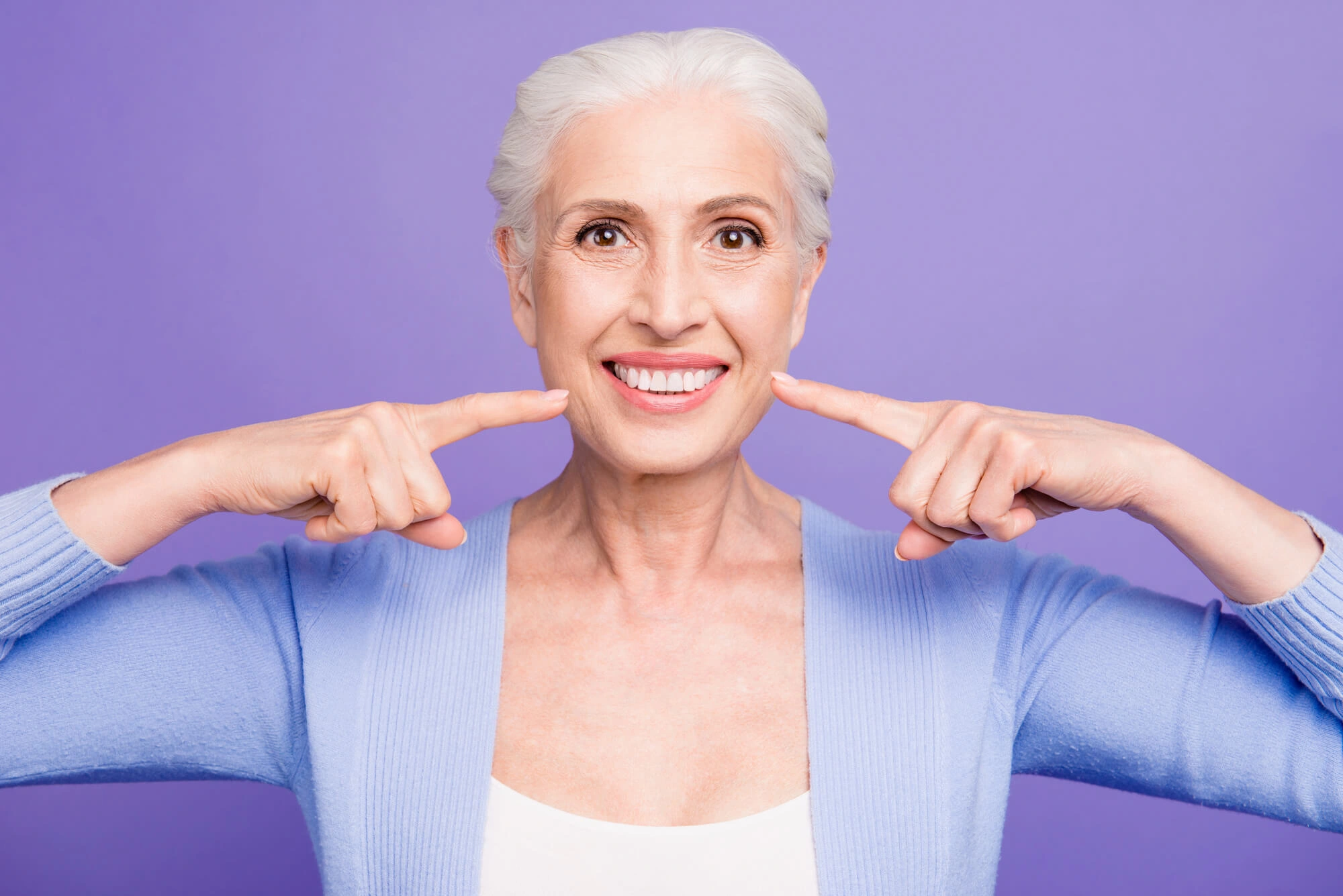 happy-senior-after-getting-Al- on-X-Dental-Implants